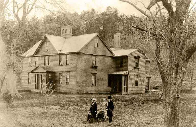 Orchard House 1865, Louisa May Alcott seated on thee ground.
